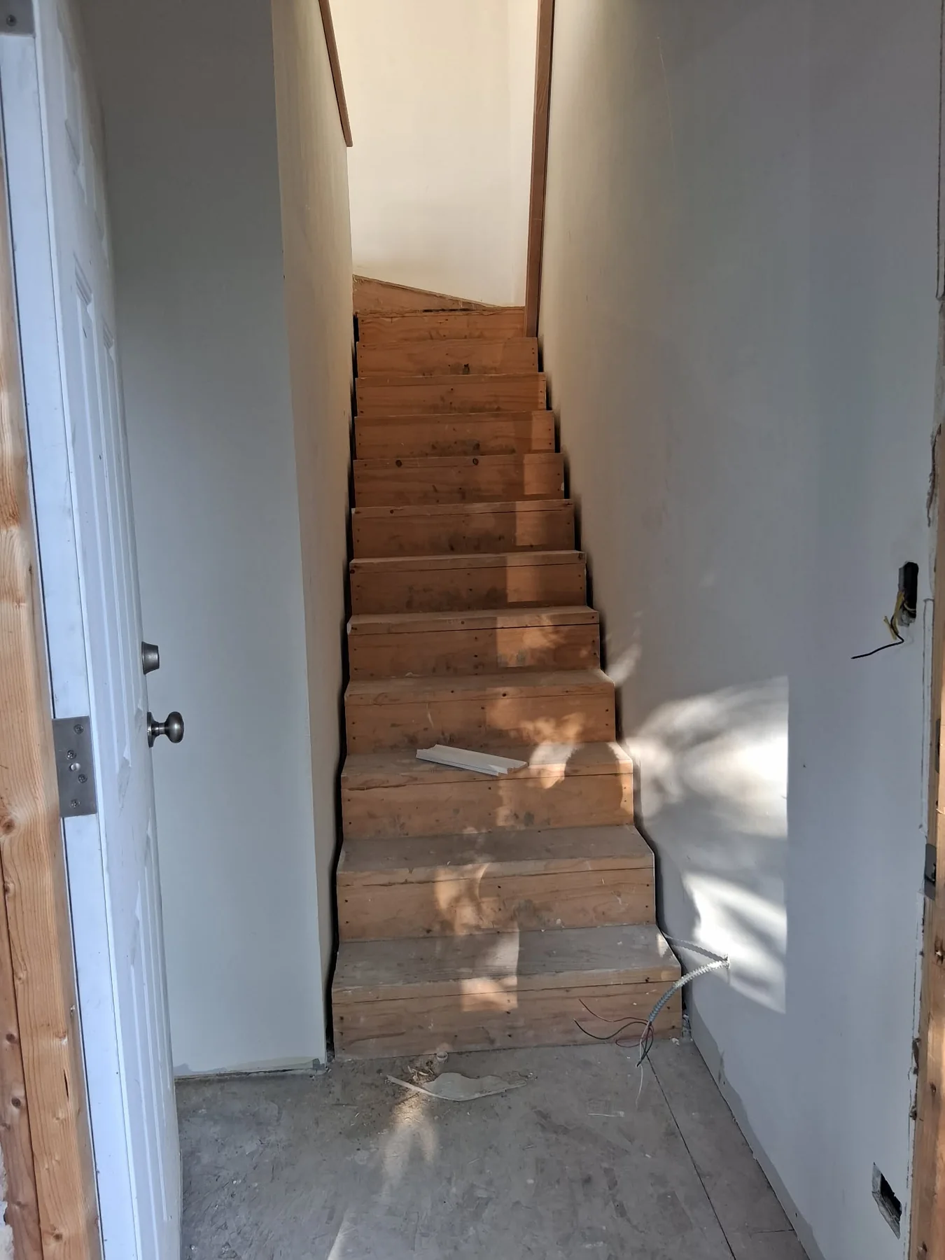Staircase construction in progress before finish installation